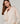 Oversized wollen trui met V-hals - Beige stoel